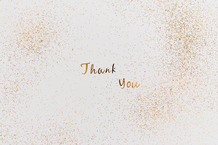 Gold Thank You Text With Gold Glitters