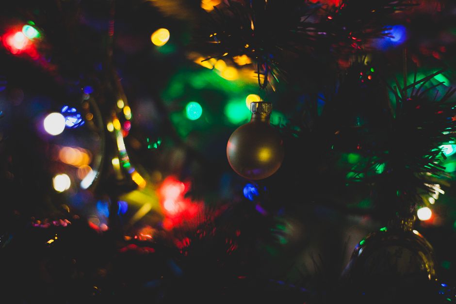 paw print tree decoration - Close-up of colorful Christmas lights and ornaments creating a festive atmosphere.