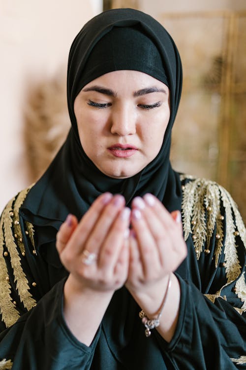 Woman in Black Hijab Prayingtra