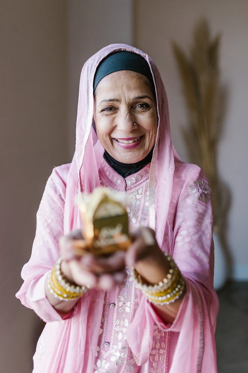 Smiling Woman in Pink and White Hijab