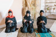 2 Women in Hijab Sitting on Floor