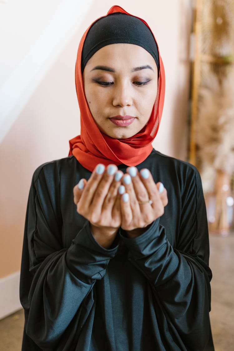 Woman In Red Hijab And Black Leather Jacket