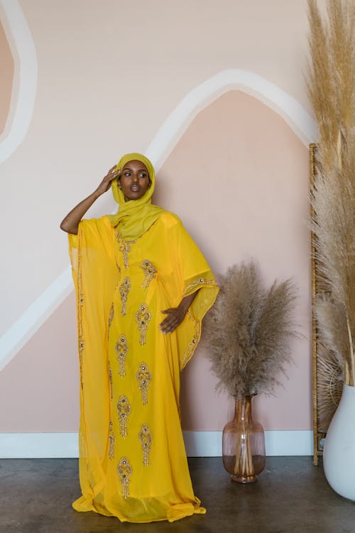 Free Woman in Yellow Traditional Clothing Stock Photo