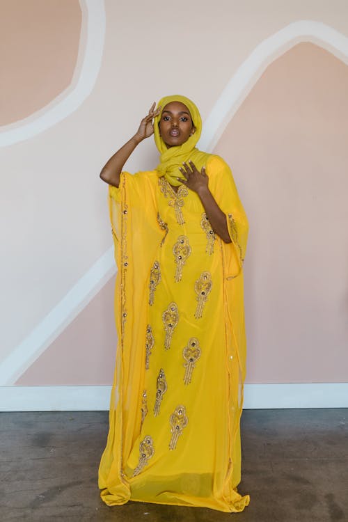 Free Woman in Yellow Hijab and Yellow Long Dress Stock Photo