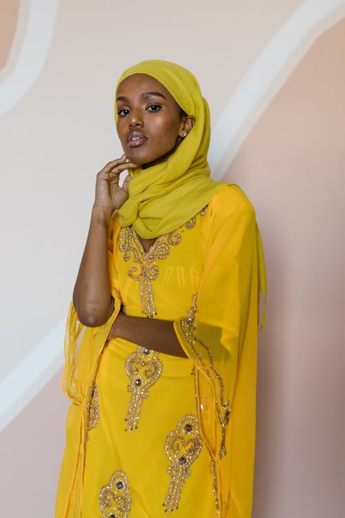 Woman in Yellow Hijab and Yellow Floral Sari