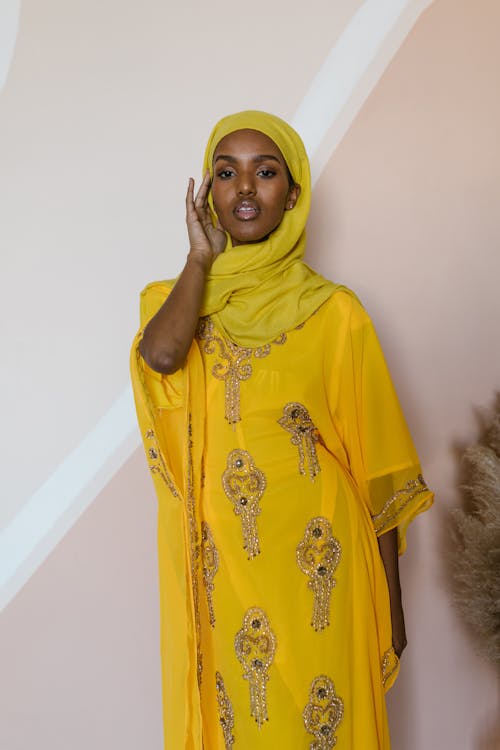 A Woman Wearing Yellow Dress Paired with a Yellow Hijab