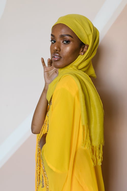 Woman in Yellow Dress Wearing Yellow Hijab
