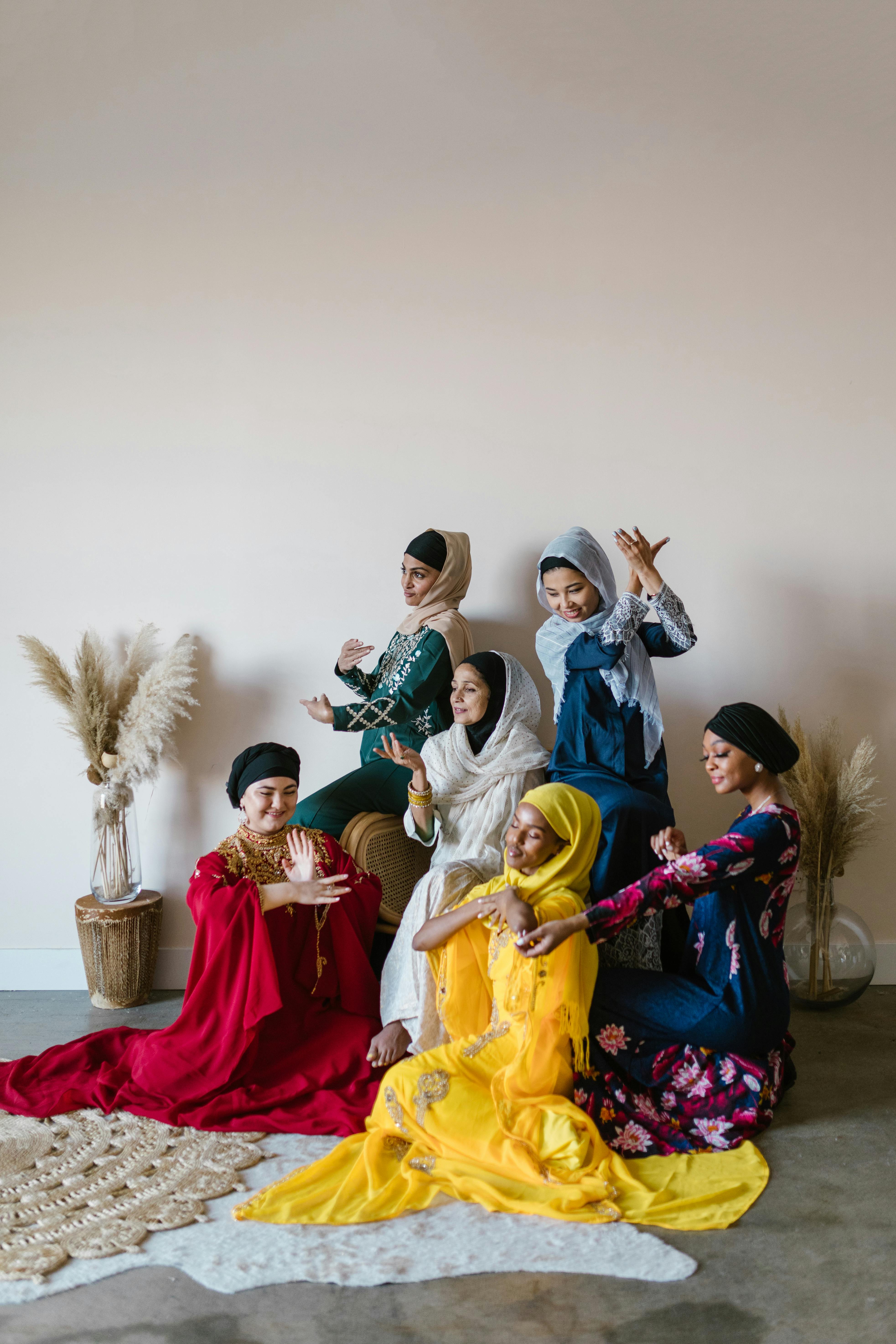 group of women wearing yellow and red traditional dress