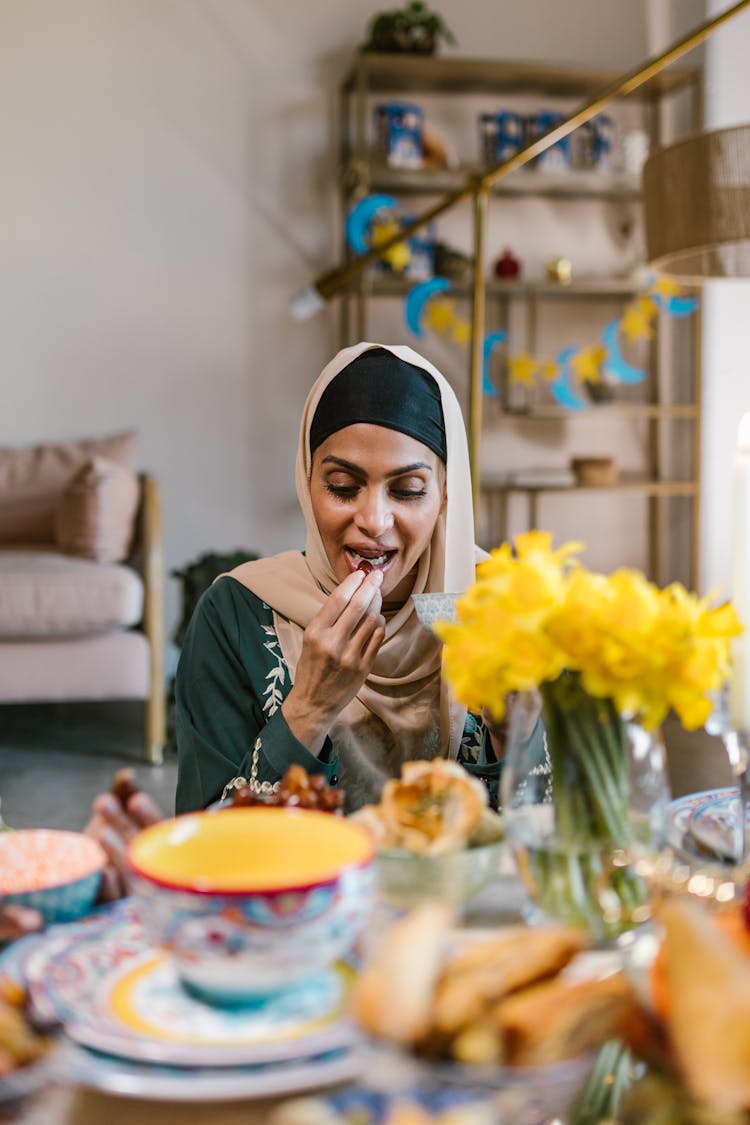 Woman In Beige Hijab Eating