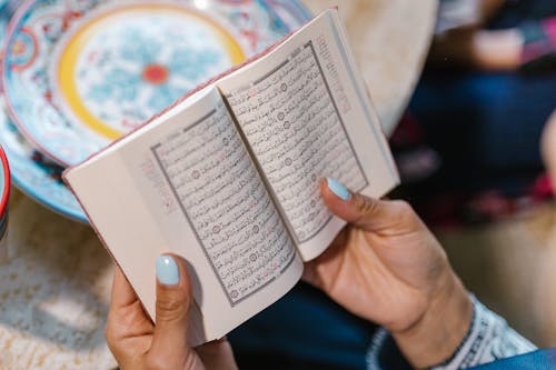 Free Person Reading And Praying Stock Photo