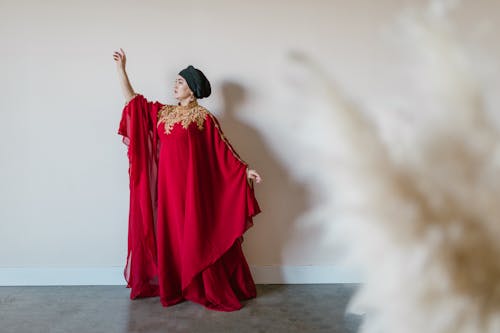 Woman in a Long Red Dress and Hijab