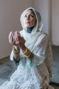 Woman in White Hijab Praying