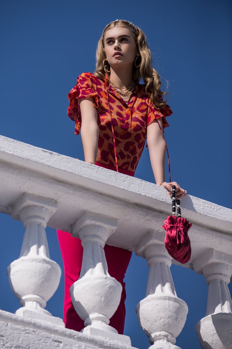 Photo Of A Woman With A Red Purse