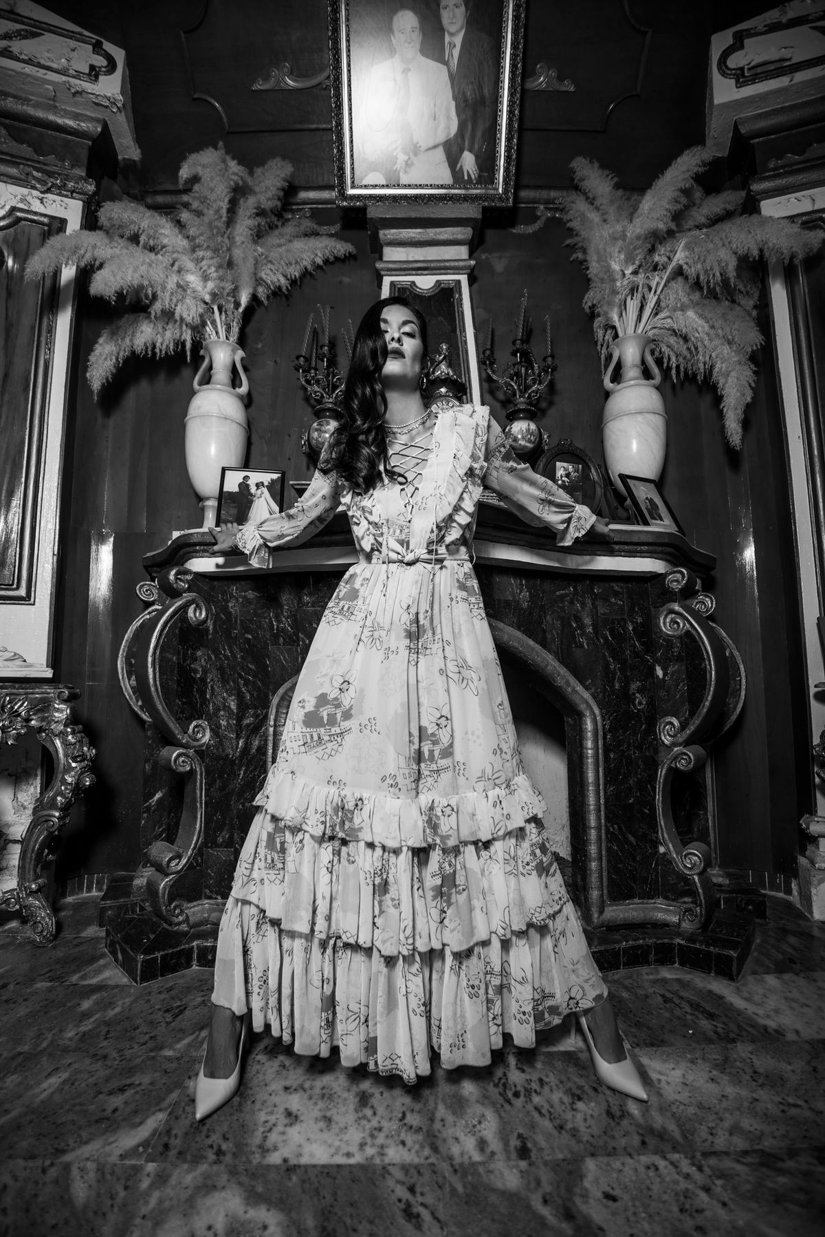 A woman in a floral dress posing — Etro's sculptural ruffle drama