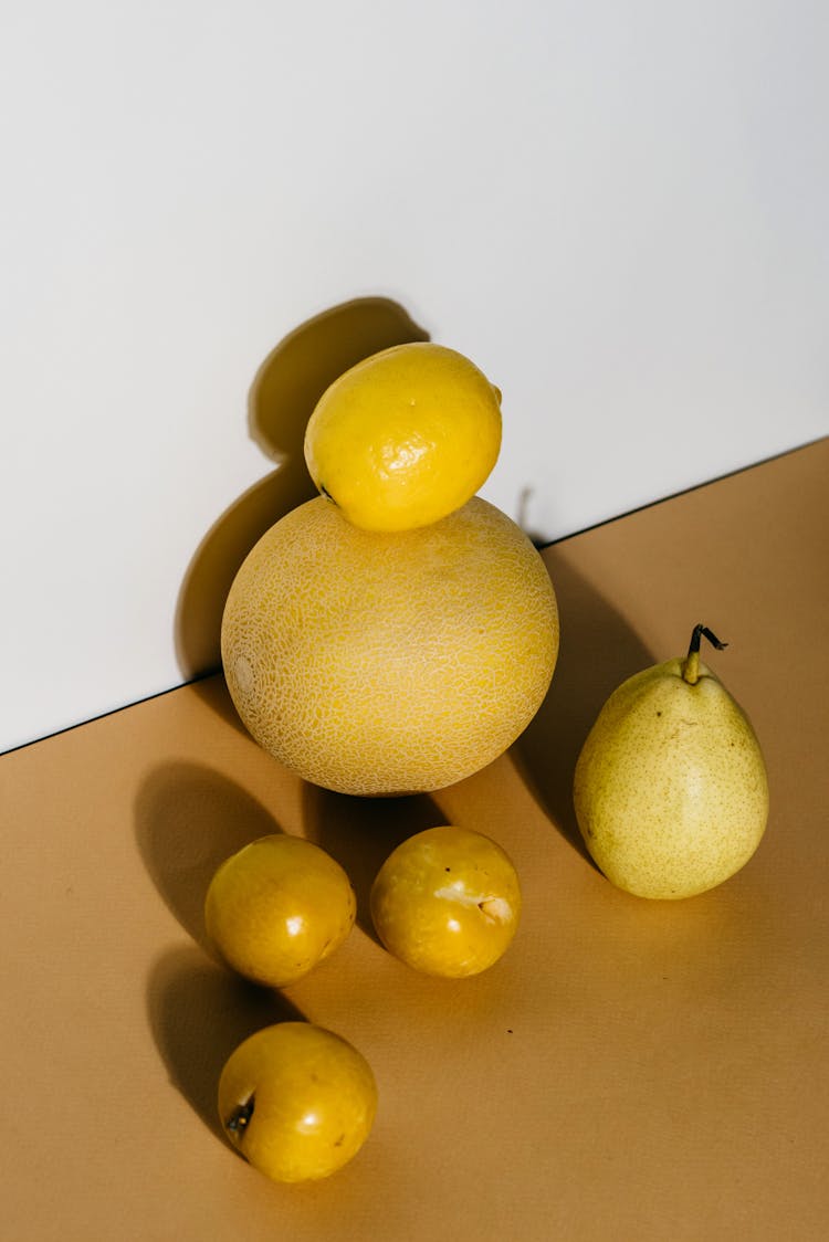 Lemon Fruit On Top Of A Melon 