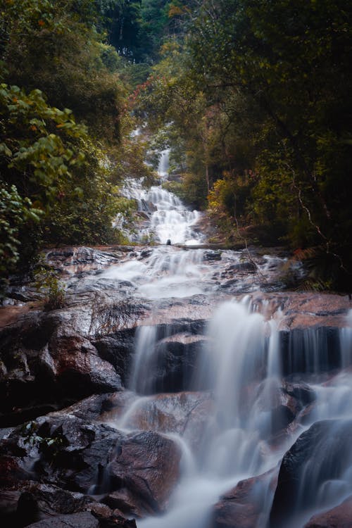 Cascading Waterfalls on Brown Rocks