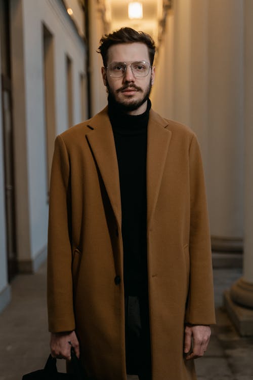 A Man Wearing a Brown Coat 