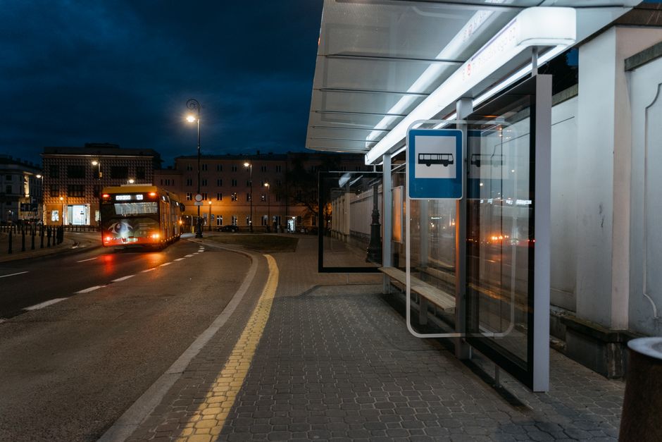 Modern public transport bus in Vilnius, Lithuania, with passengers waiting at a stop