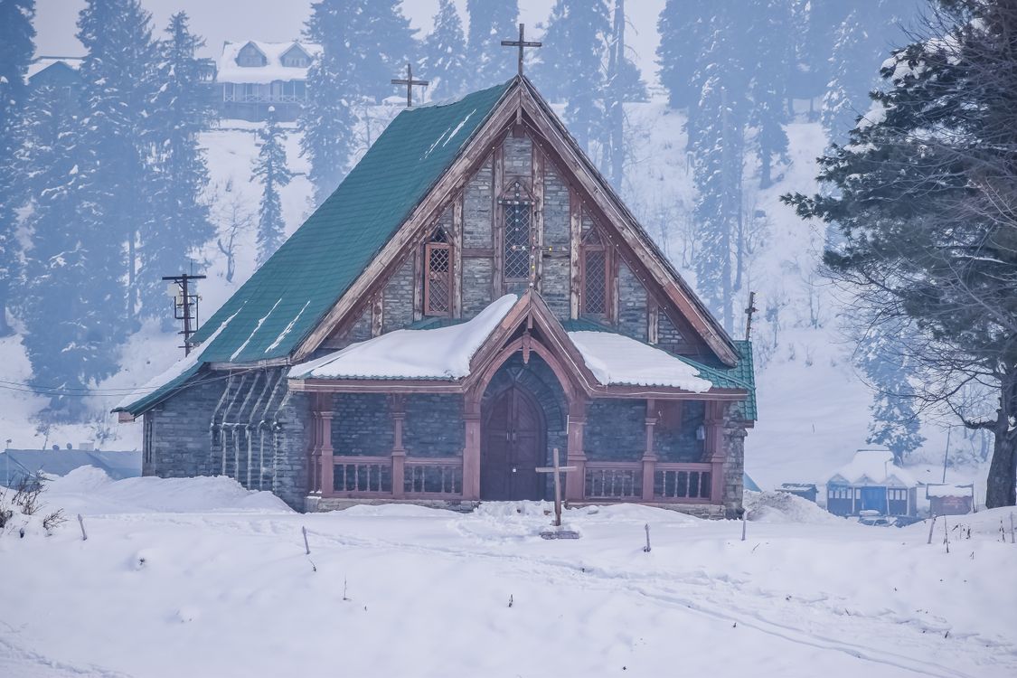 A Wooden Chapel on a Snow Covered Ground · Free Stock Photo