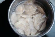 Dumplings Cooking in the Stainless Cooking Pot with Water