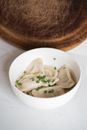 Raw Dumplings in a Bowl