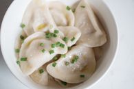 Steamed Dumplings with Onion Leeks in a Ceramic Bowl