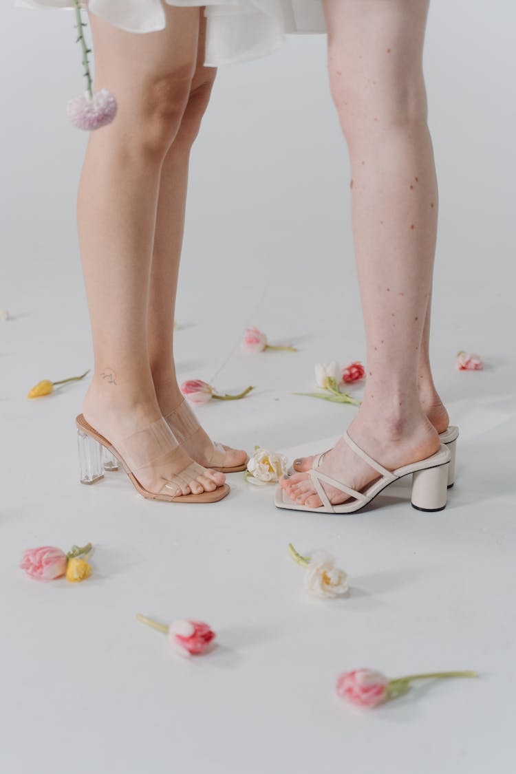 Two Women Wearing Heeled Sandals