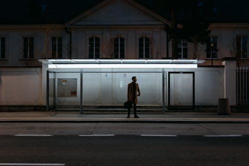 Silhouette of Man Standing on Platform
