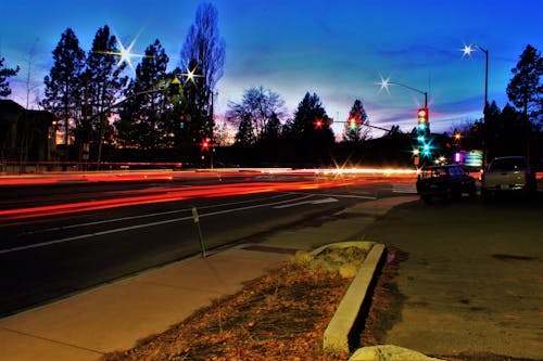 Time Lapse Photo of Cars  During Dawn