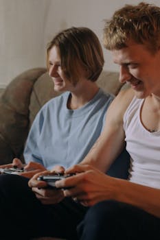 A young couple happily playing video games together in a cozy living room setting.
