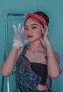 A Woman with Kerchief Wearing Hand Gloves Touching Her Face