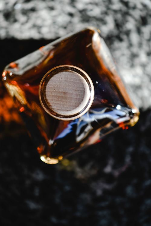 Free Top view of a brandy bottle with a cork, capturing the classic elegance of distilled spirits. Stock Photo