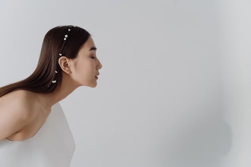 Woman with Eyes Closed on White Background