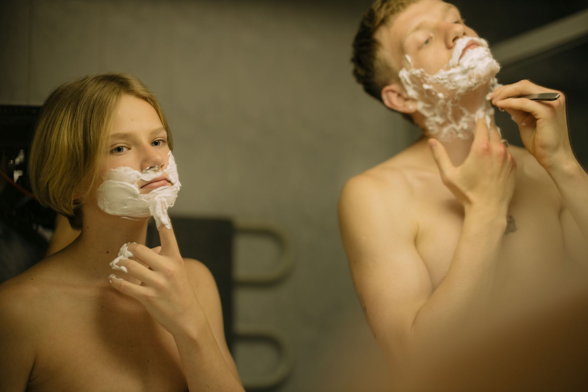 Unlock Clear Skin: Gua Sha Face Techniques 1 Two brothers engaging in a morning shaving routine, enhancing brotherly bonds.