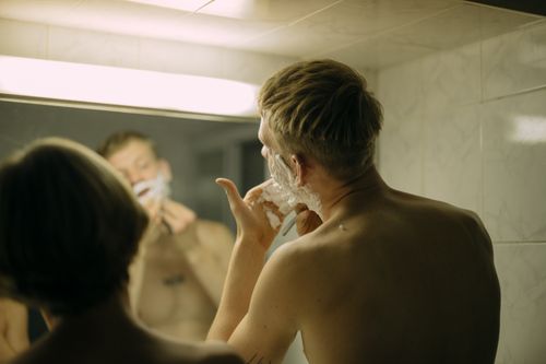 Free Two men shaving in a bathroom, focusing on hygiene and morning routine. Stock Photo