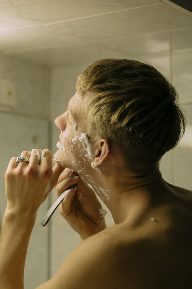 A Man With Shaving Cream On His Face