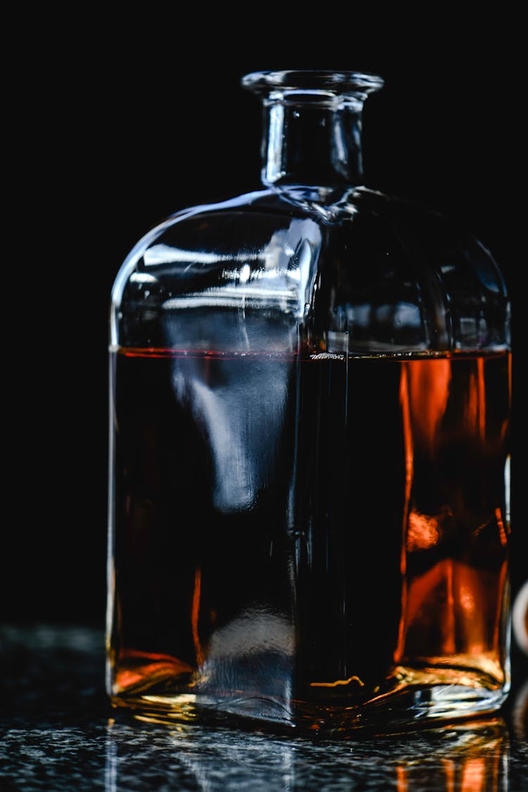 A Dark Brown Liquor In A Decanter