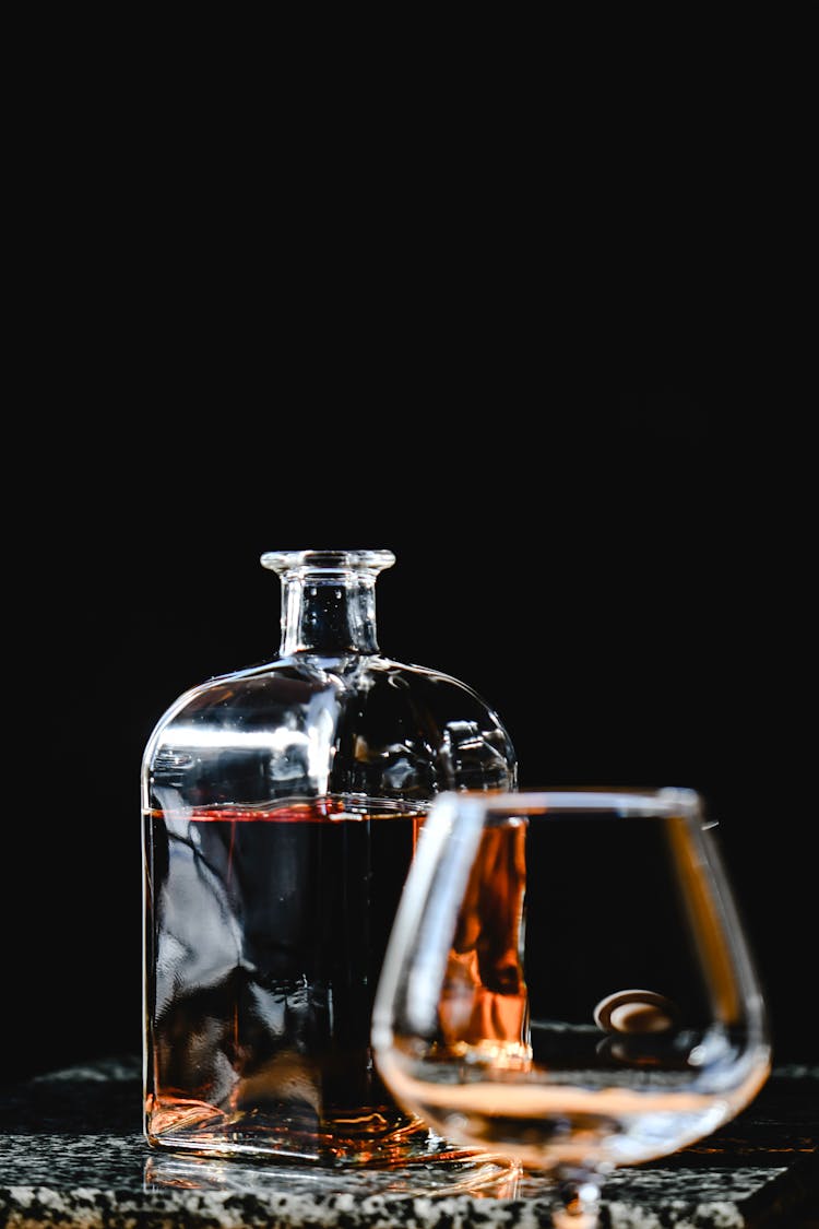 A Dark Brown Liquor In A Decanter