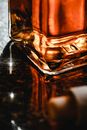 Clear Glass Bottle on Brown Wooden Table