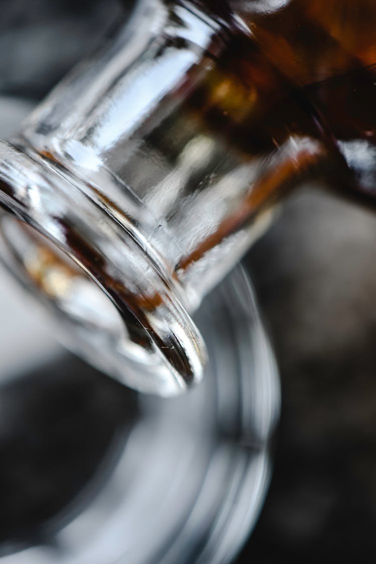 Rim Of A Clear Glass Bottle In Close-up Photography