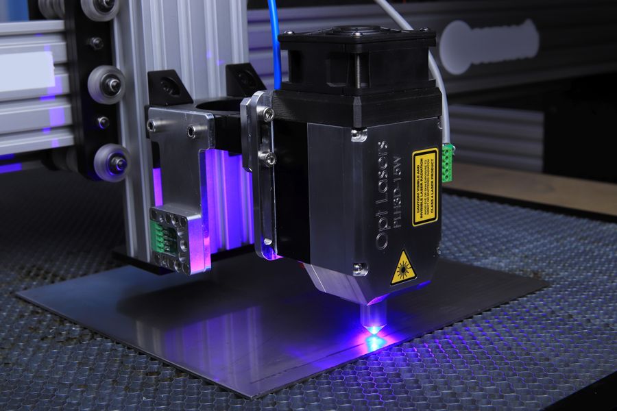 Laser marking machine engraving a metal surface
