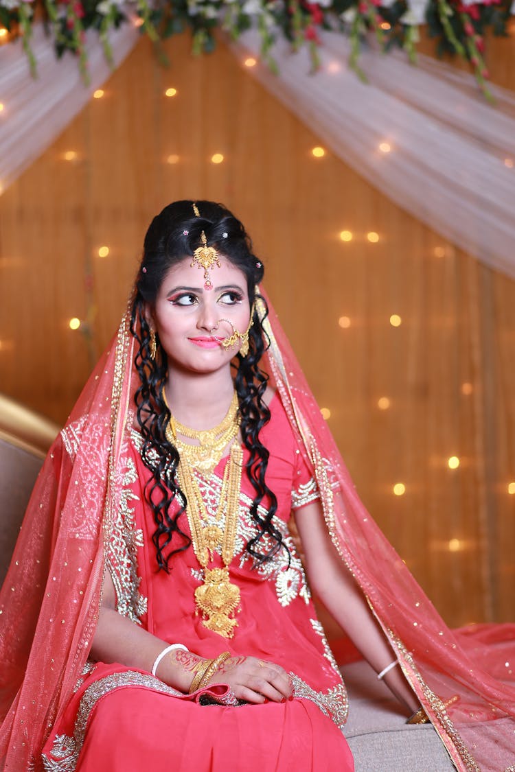 Woman In Pink And Beige Floral Traditional Dress