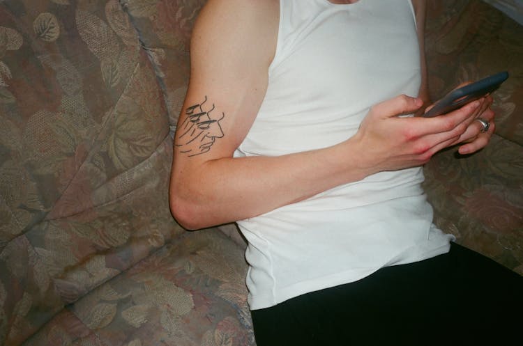 Man With A Tattoo On His Arm