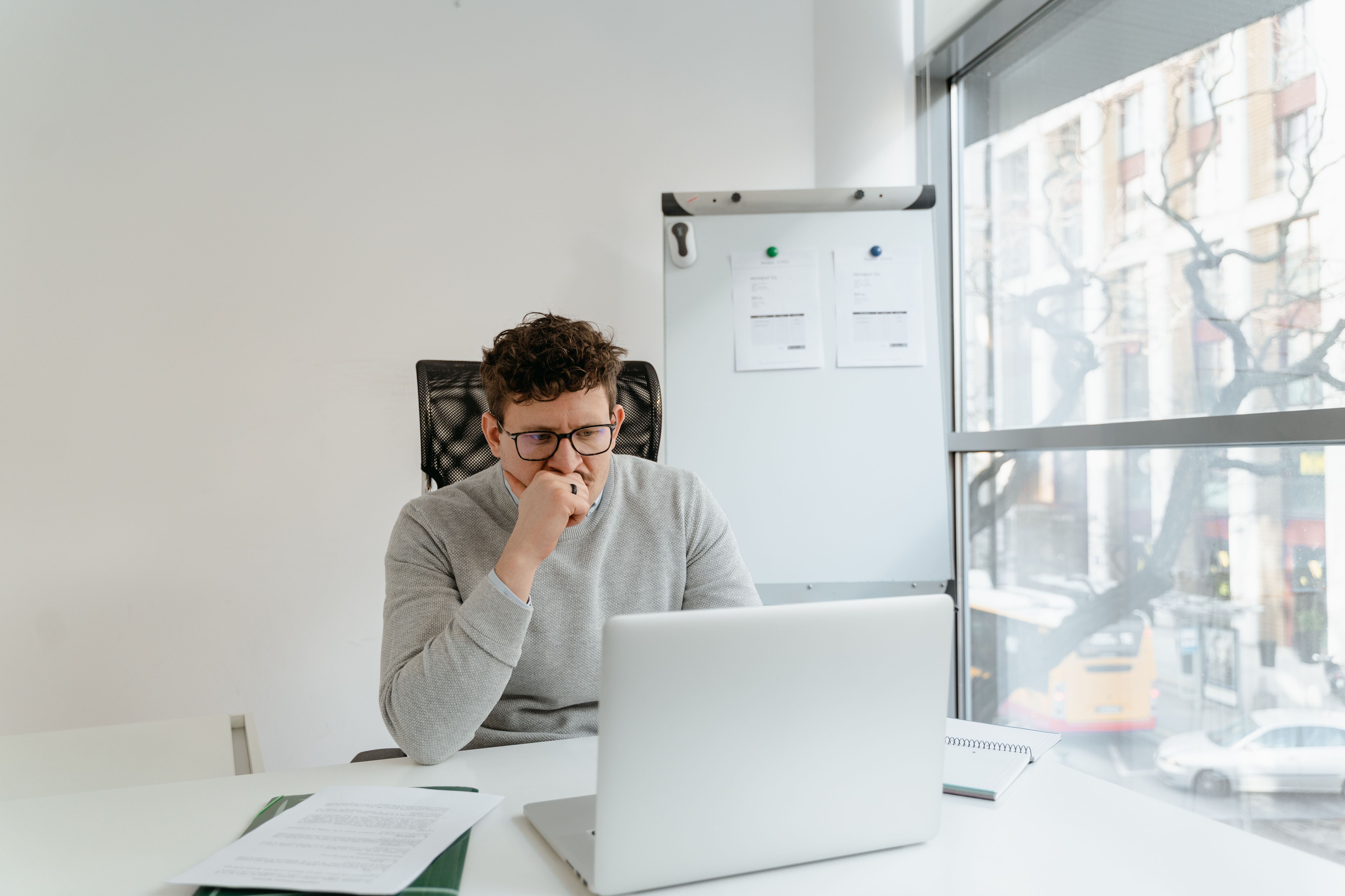 A thoughtful founder analyzing complex software pricing and evaluating risk