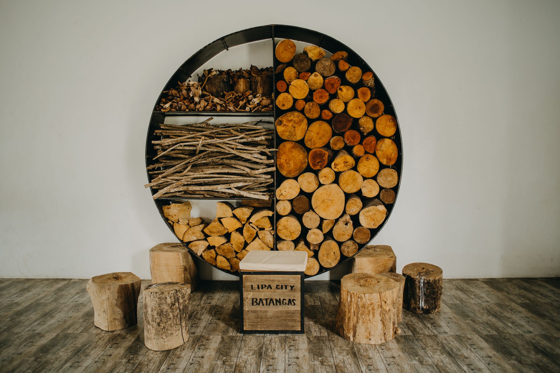 Artistic wooden log and branch storage in Lipa City, Batangas, showcasing rustic decor.