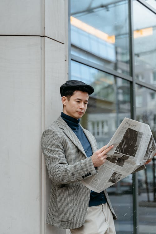 Free Stylish Man Reading Newspaper Stock Photo