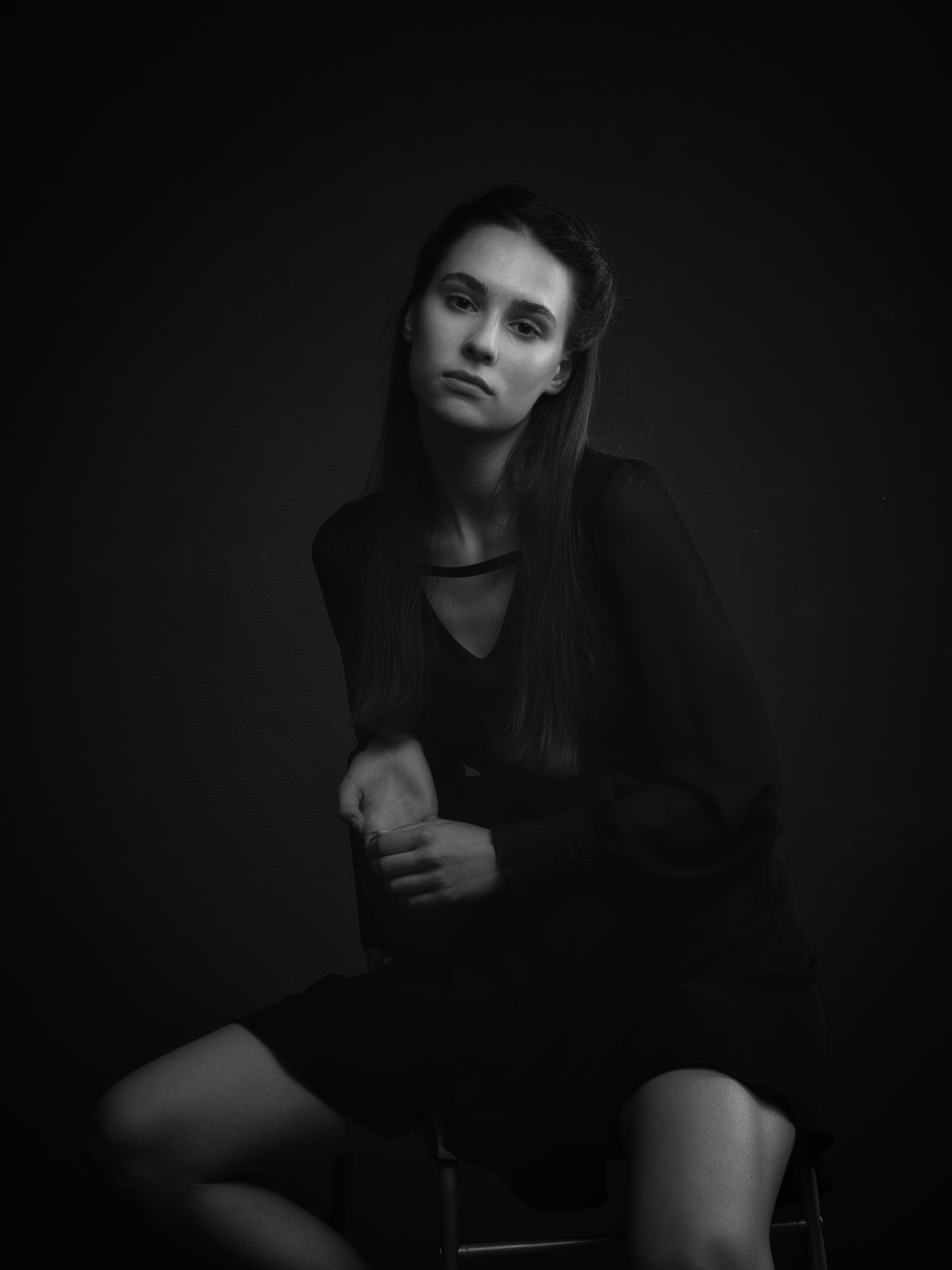 A Woman in Black Dress Sitting on a Chair · Free Stock Photo
