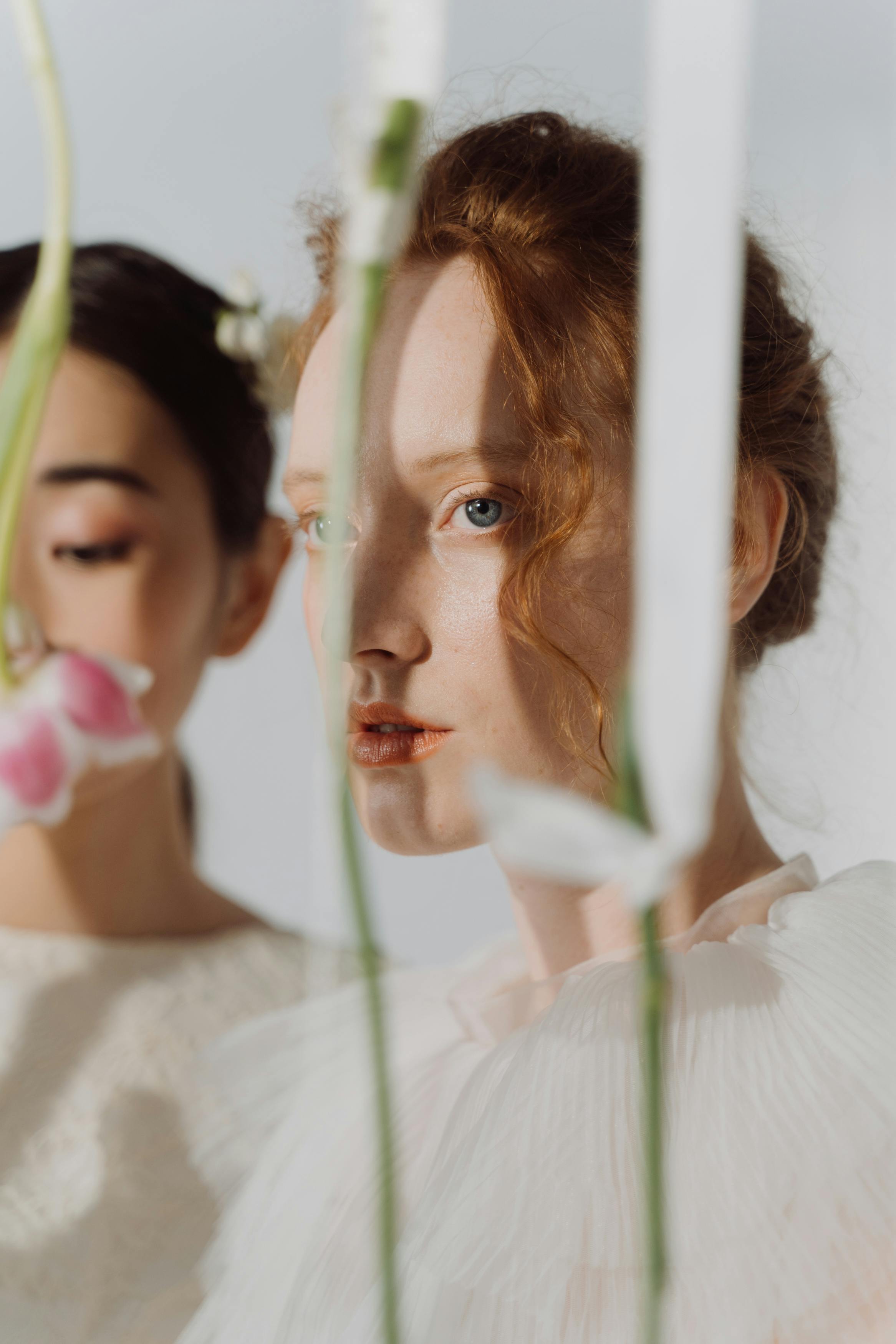 women with flowers on white background