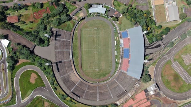 Stunning aerial view of Londrina's iconic football stadium surrounded by lush greenery.