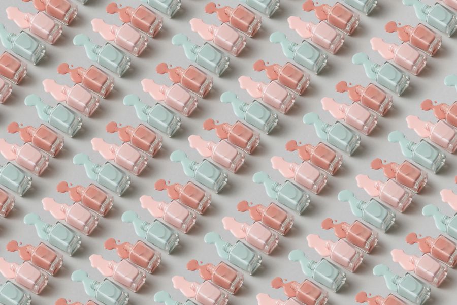 Pastel lacquer bottles arranged in a repeating pattern